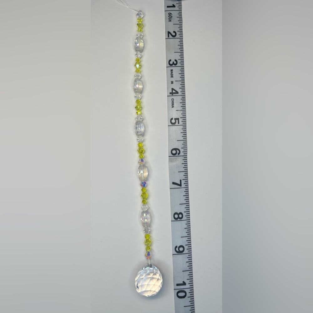Mini suncatcher with yellow/clear glass beads.